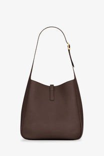 Brown leather hobo bag with gold-tone buckle and minimalist design from Saint Laurent women’s le à collection