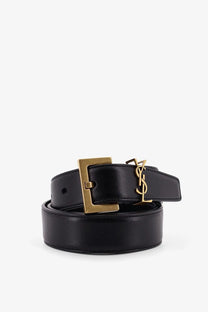 Saint Laurent women’s black leather belt with gold-tone rectangular buckle and interlocking YSL logo on the strap