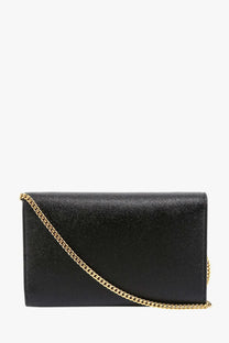 Saint Laurent women’s black leather crossbody bag with textured clutch and gold chain strap
