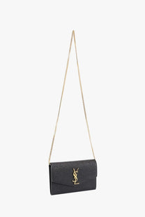 Saint Laurent women’s black leather crossbody bag with textured leather, gold-tone chain strap, and monogram clasp