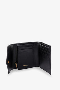 Saint Laurent women’s black leather trifold wallet with gold-tone hardware and embossed Saint Laurent Paris logo inside