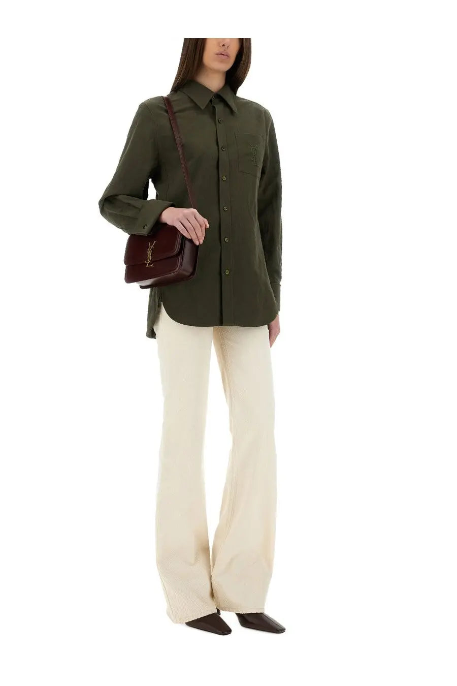 A burgundy leather crossbody bag with a gold-tone ysl logo paired with a saint laurent green linen and cotton cassandre shirt