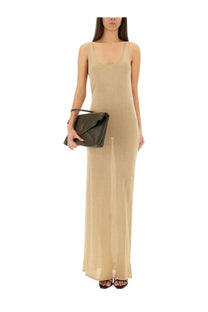Dark green leather clutch with gold ysl logo and flap closure paired with saint laurent women’s lurex knit dress gold