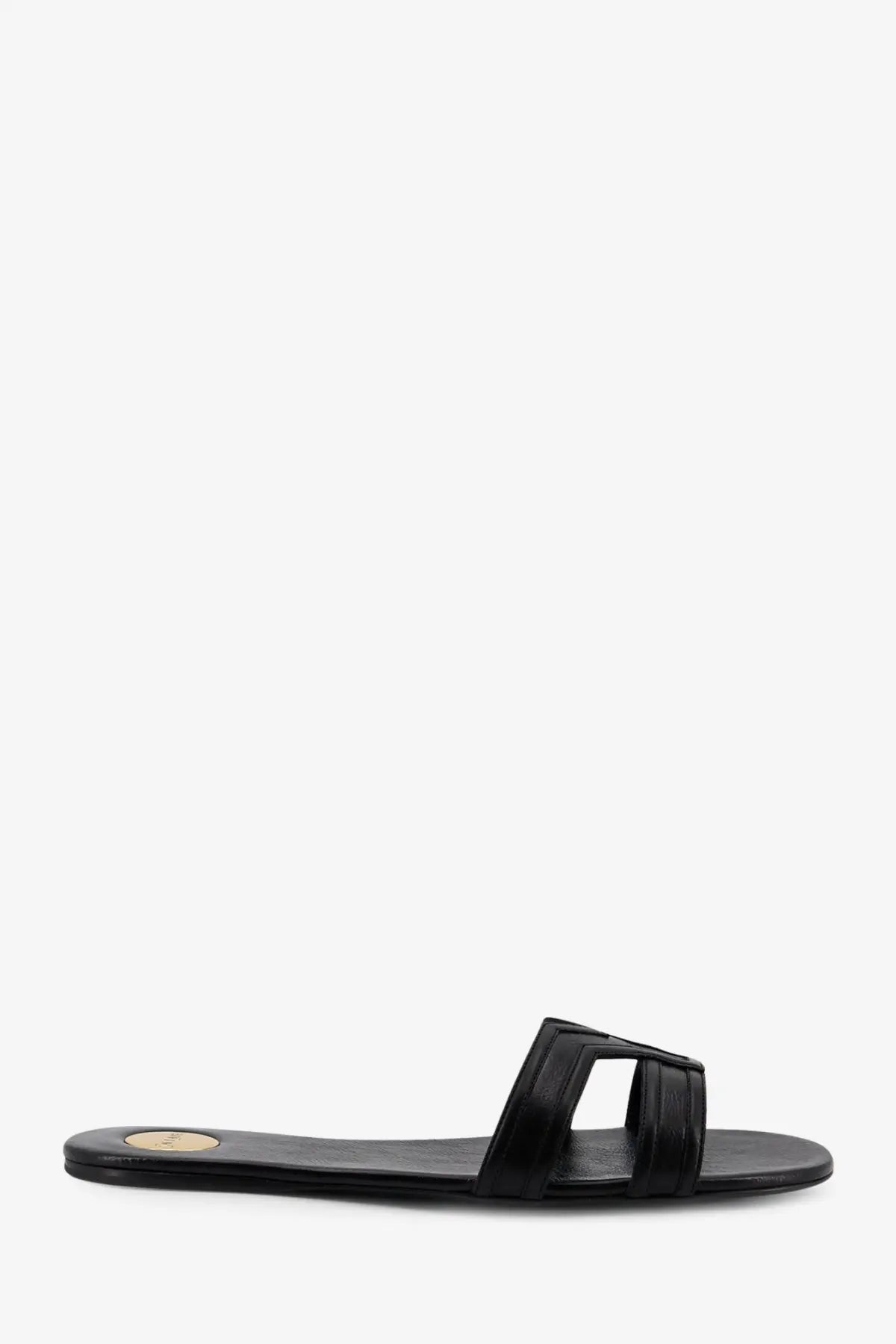 Saint Laurent women’s Mabrouka black leather slide sandal with minimalist design and rectangular strap detail