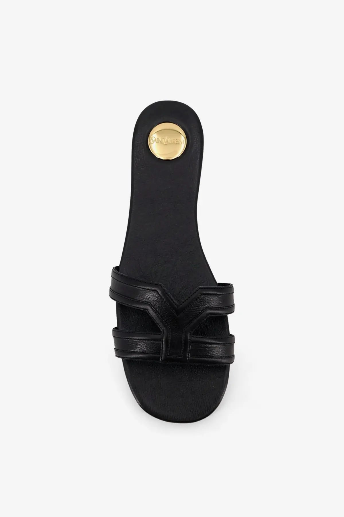 Back view of saint laurent women’s mabrouka black leather slide sandal with gold-tone circular logo on heel