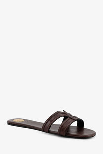 Saint Laurent women’s brown leather slide sandal with braided strap design and gold-toned circular logo on insole