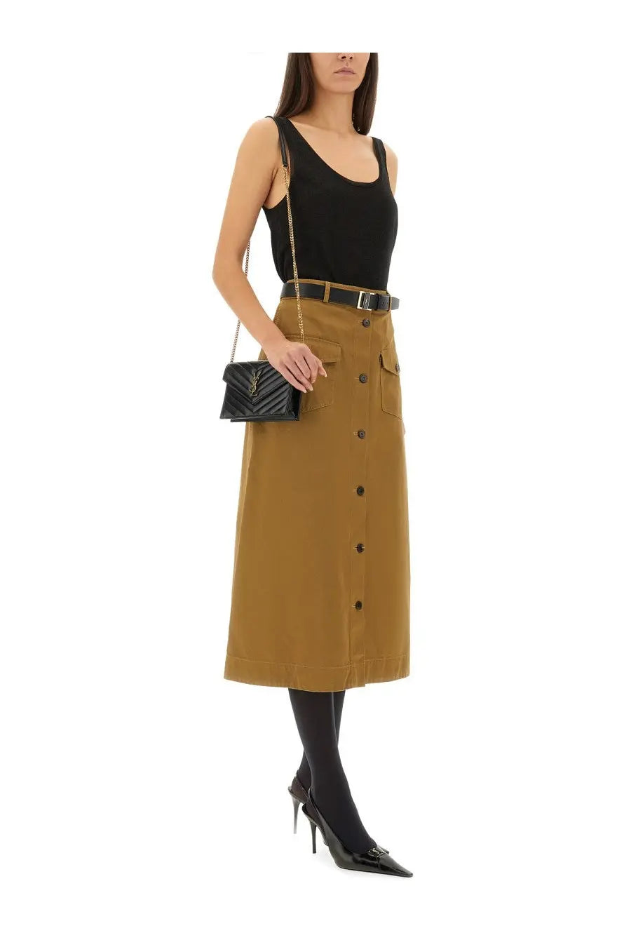 Black quilted leather crossbody bag with gold tone chain strap paired with saint laurent women’s beige midi skirt