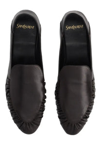 Saint Laurent Women’s moccasin Alain black leather loafers with ruched design and gold embroidered logo lining