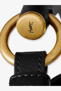 Saint Laurent women’s Mombasa leather handbag black with black leather strap gold-tone metal ring and YSL logo plaque