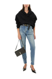 Black quilted leather ysl mini crossbody bag with gold-tone hardware complementing saint laurent women’s neck sweatshirt