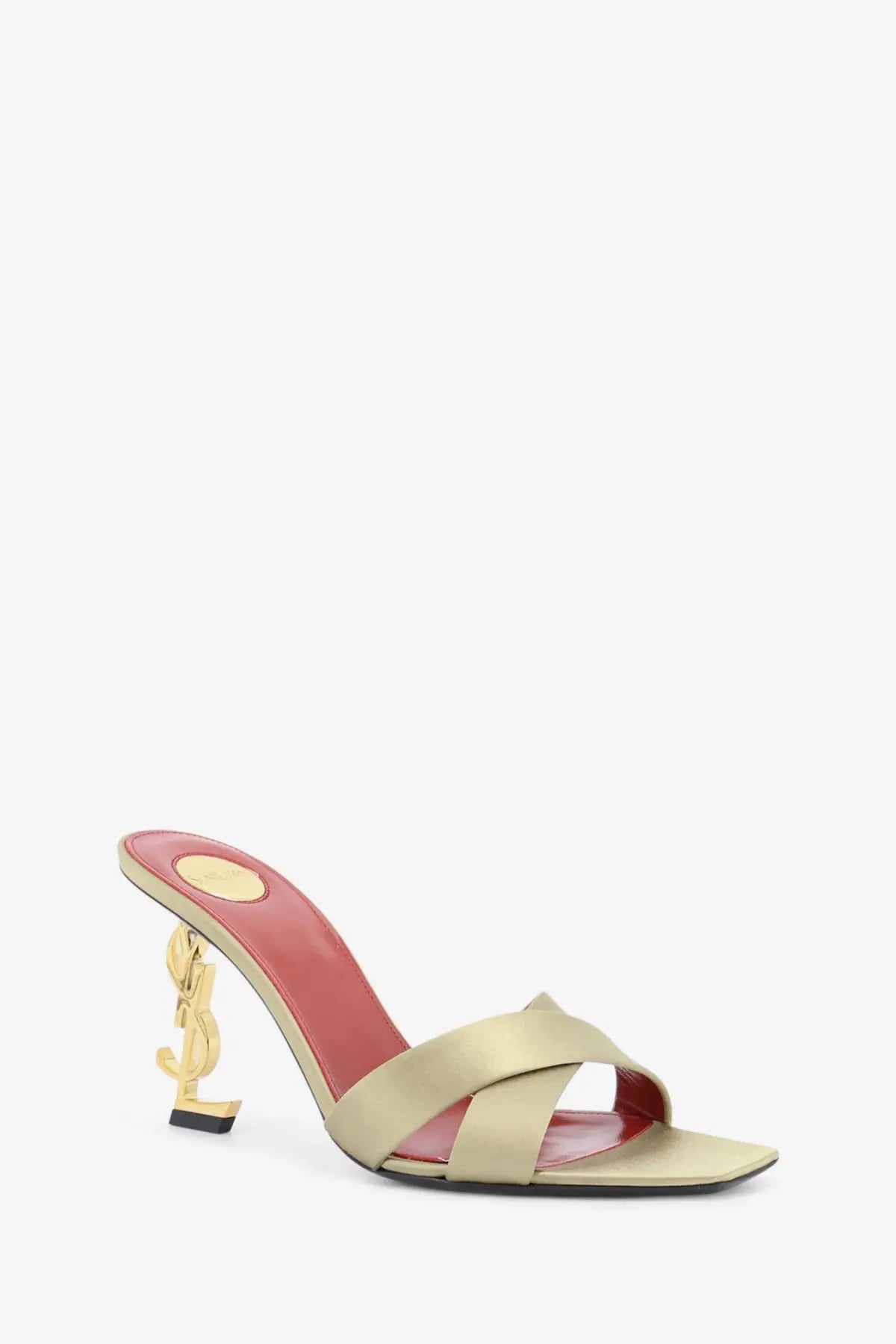 Saint Laurent women’s opyum satin mule sandals in gold beige with a distinctive gold YSL logo heel shown from back