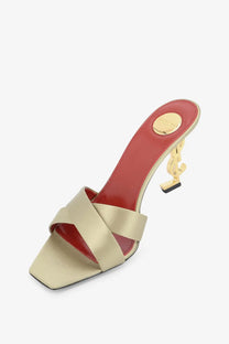 Saint Laurent women’s opyum satin sandals beige with red leather interior and gold-tone YSL logo heel visible from the back