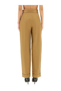 Saint Laurent women’s high-waisted camel-colored gurkha serge wide-leg trousers with sleek tailored fit and rolled cuffs