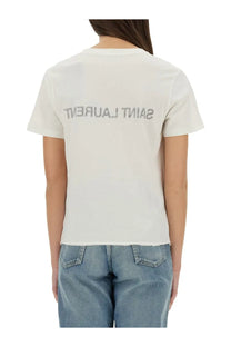 Back view of white saint laurent women’s t-shirt with silver lettering across the cotton fabric