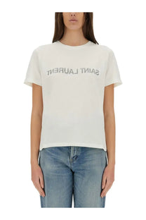 Saint Laurent women’s white cotton t-shirt with silver lettering across the chest from the Saint Laurent reverse shirt line