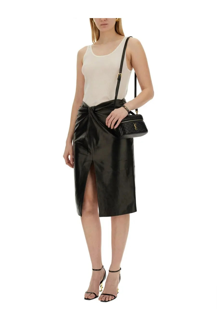 Saint Laurent women’s beige round neckline tank top paired with black leather crossbody bag with gold ysl logo
