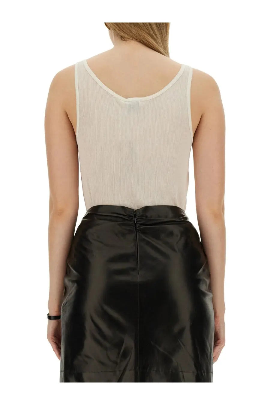 Saint laurent women’s beige round neckline tank top paired with sleek black patent leather high waist skirt back view