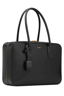 Saint Laurent women’s sac de jour black leather tote bag with gold-tone hardware and minimalist design