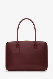 Saint Laurent women’s sac de jour red burgundy leather satchel with curved top handles and gold-tone zipper closure