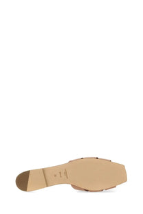 Beige leather slide sandal with minimalist design and flat sole from saint laurent women’s nu pieds tribute collection