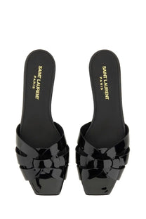Saint Laurent women’s sandal Nu Pieds Tribute black patent leather slide with braided design and square toe