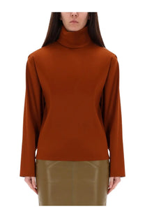 Saint Laurent women’s rust-colored silk turtleneck top with long sleeves and a fitted silhouette