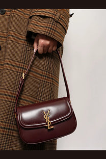 Saint Laurent women’s solferino mini burgundy leather crossbody bag with gold-tone YSL logo clasp