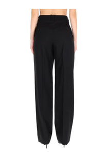 Saint Laurent women’s tailored black high-waisted wide-leg trousers with buttoned pockets front view