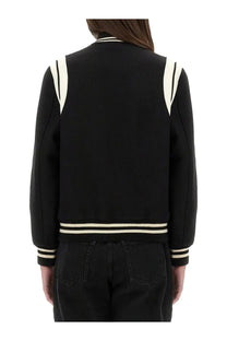 Saint Laurent women’s teddy wool varsity jacket in black with cream stripes on shoulders cuffs and hem