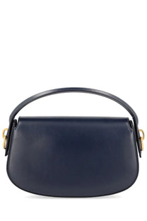 A sleek navy blue leather saint Laurent women’s Voltaire handbag with curved top handle and gold-tone hardware
