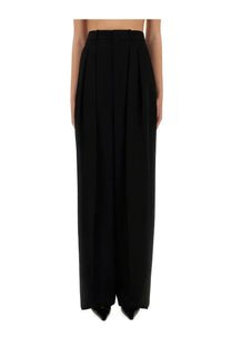 Saint Laurent women’s wide leg black high-waisted trousers in grain de poudre with tailored pleated design