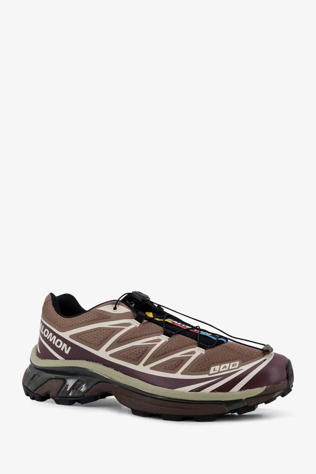 Salomon men’s mesh sneakers in brown with beige accents featuring a rugged trail-ready design and durable materials
