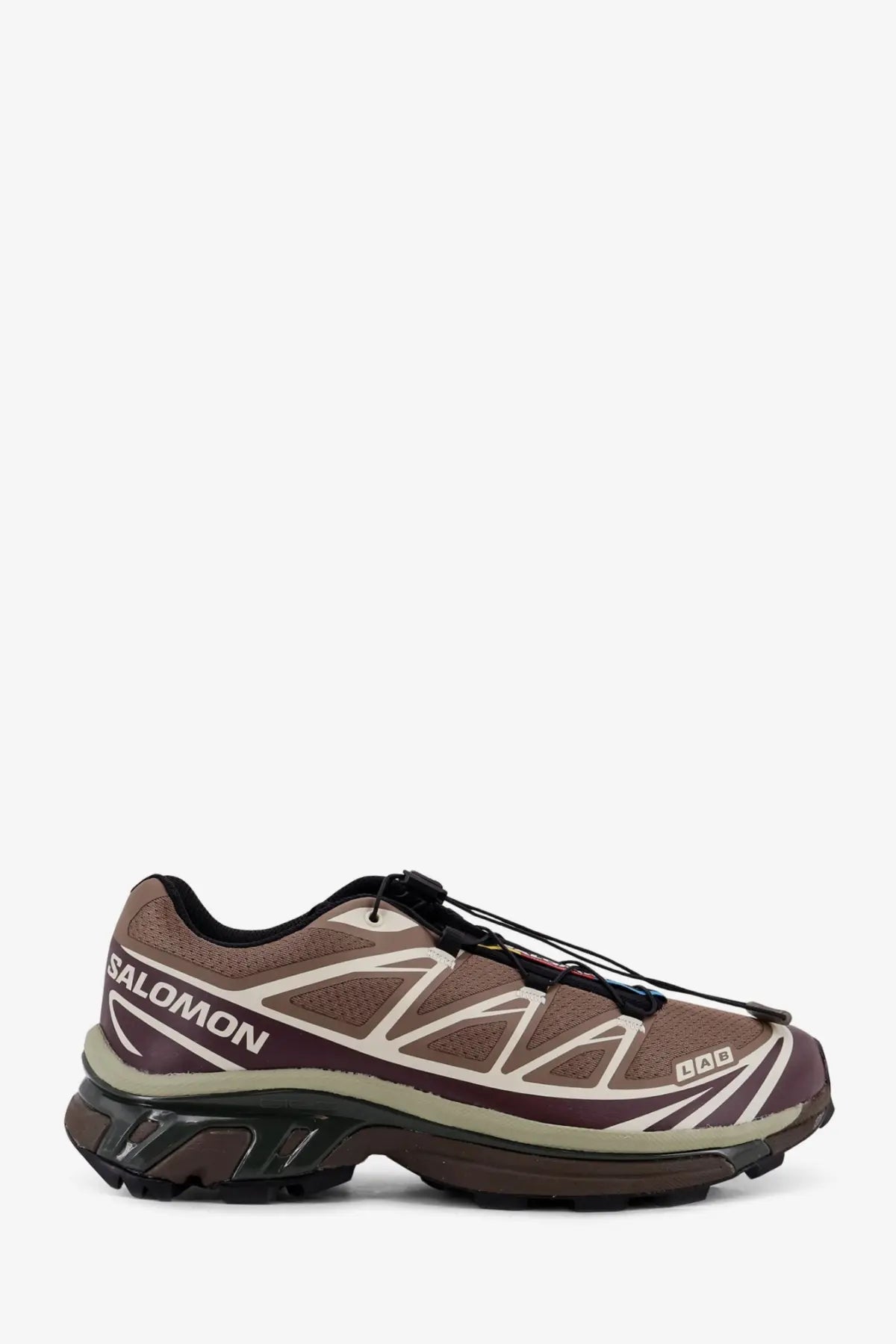 Salomon men’s mesh sneakers in brown with beige accents black laces and a rugged outsole for trail running