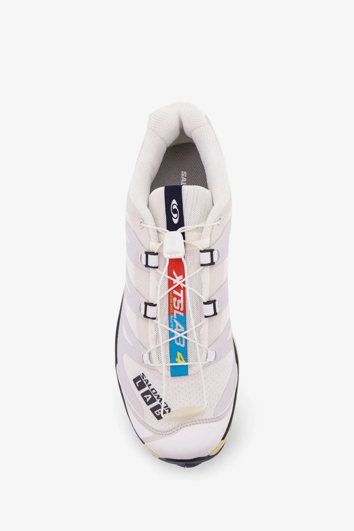 White Salomon XA4 trail running shoe with black and red accents mesh upper and bold branding on the side