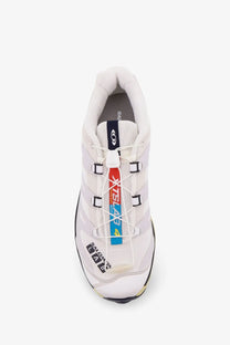 White Salomon XA4 trail running shoe with black and red accents mesh upper and bold branding on the side