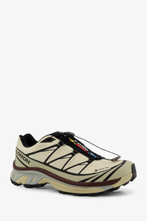Beige and black salomon xa pro 5 gtx trail running shoe with waterproof rugged design for men in technical fabric green