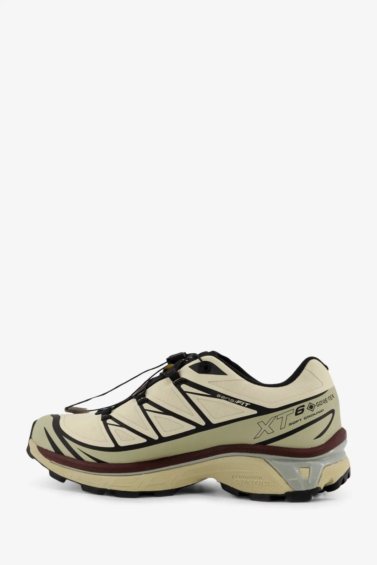 Beige and black salomon men’s technical fabric sneakers with breathable mesh upper and rugged outsole for trail running