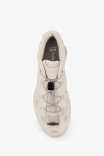 Cream-colored salomon x ultra 3 trail running shoe with mesh and synthetic overlays and rugged outsole in white