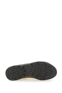Black rubber sole with textured geometric tread and salomon logo on the heel of salomon unisex alp sneaker beige