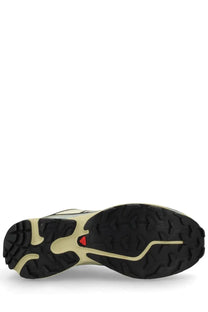 Back view of salomon unisex sneaker xt white in black and beige with rugged outsole and red salomon logo on the heel