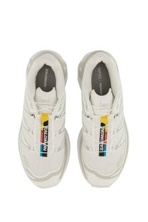 Salomon unisex sneaker XT white with a sleek mesh upper and bold yellow and black branding stripes along the laces