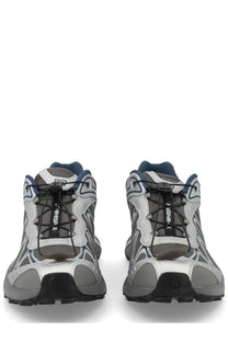 Salomon unisex XT Whisper sneaker in silver with gray mesh, black laces, and blue accents for running