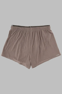 Beige perforated mesh athletic shorts with dark gray elastic waistband for men by satisfy in space beige color