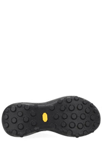 Black rubber sole of satisfy men’s sneaker therocker black with yellow vibram logo and circular traction lugs