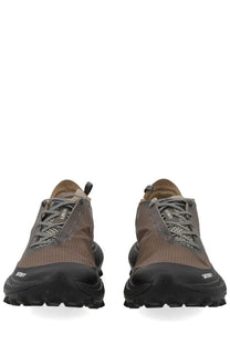 Satisfy men’s sneaker therocker brown trail running shoe with brown black textured upper rugged outsole and santafe branding