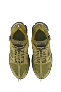 Olive green saucony men’s progrid triumph sneaker with mesh and synthetic overlays and black rubber sole