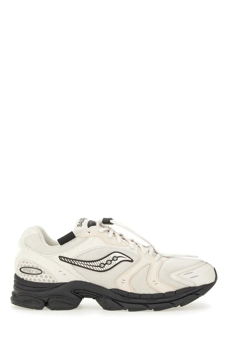 Cream-colored saucony men’s progrid triumph sneaker with black accents and distinctive wave logo on the side