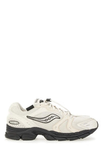 Cream-colored saucony men’s progrid triumph sneaker with black accents and distinctive wave logo on the side