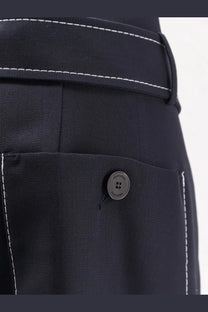 Dark navy seafarer women’s irony virgin wool trousers with contrasting white stitching and branded button