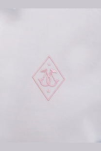 A delicate pink embroidered logo patch with interlocking initials on the seafarer women’s kim cotton shirt white